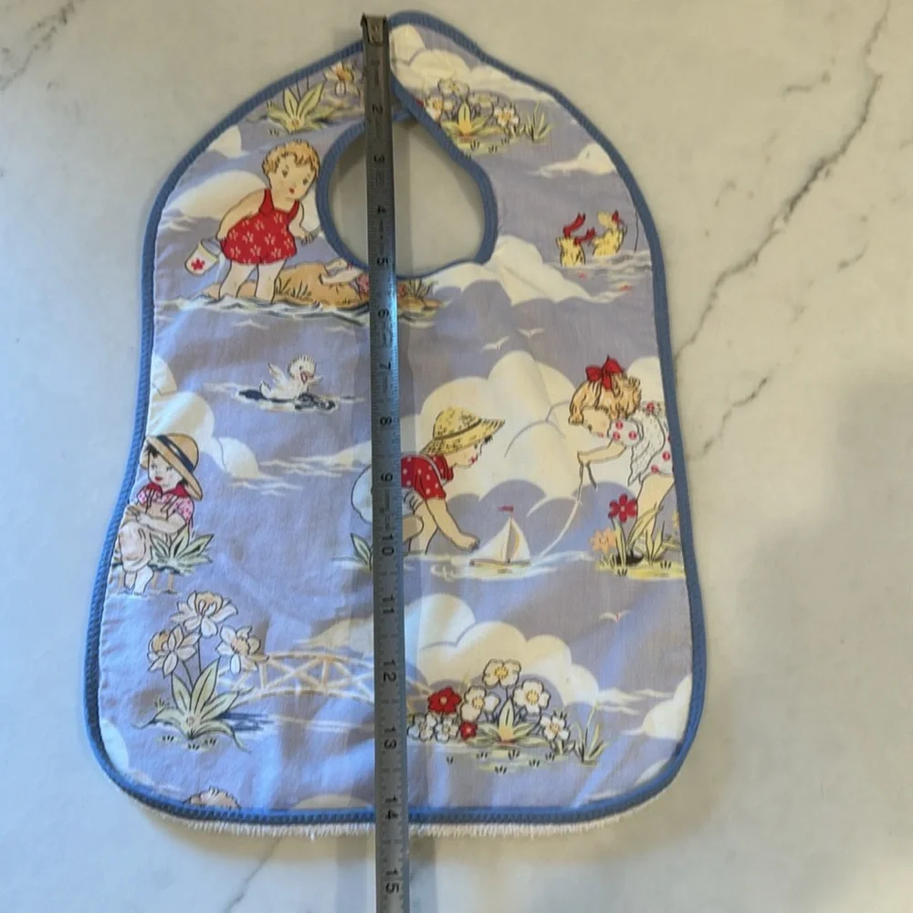 Adorable vintage beach print bib with terry backing